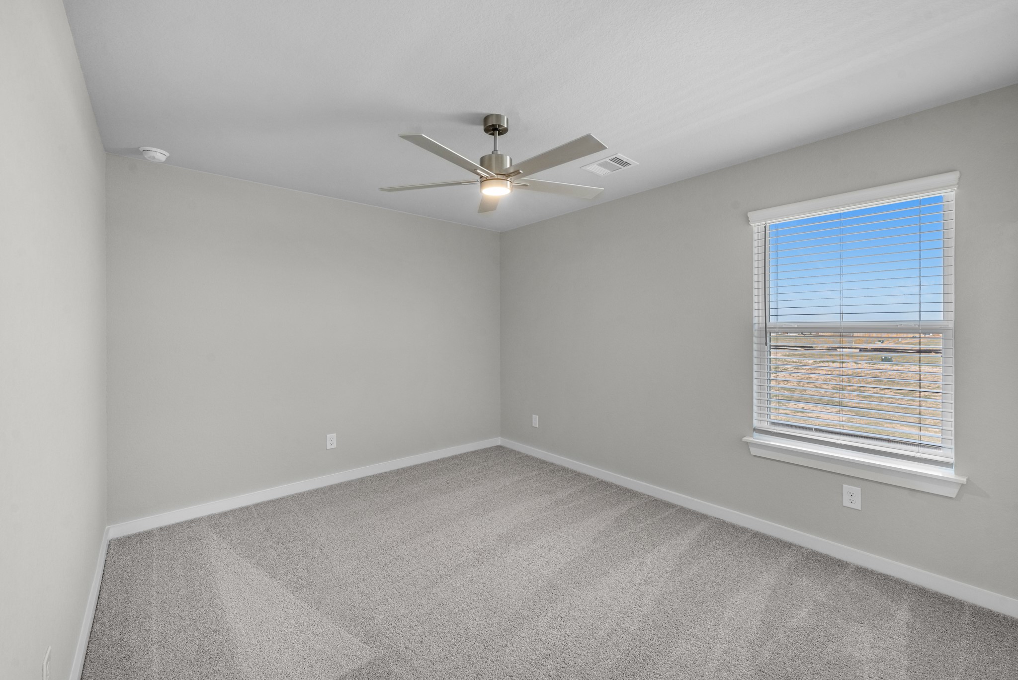 2129 Sunflower View Street Brookshire, TX 77423 - Photo 21 of 29 an empty room with a window and a fan