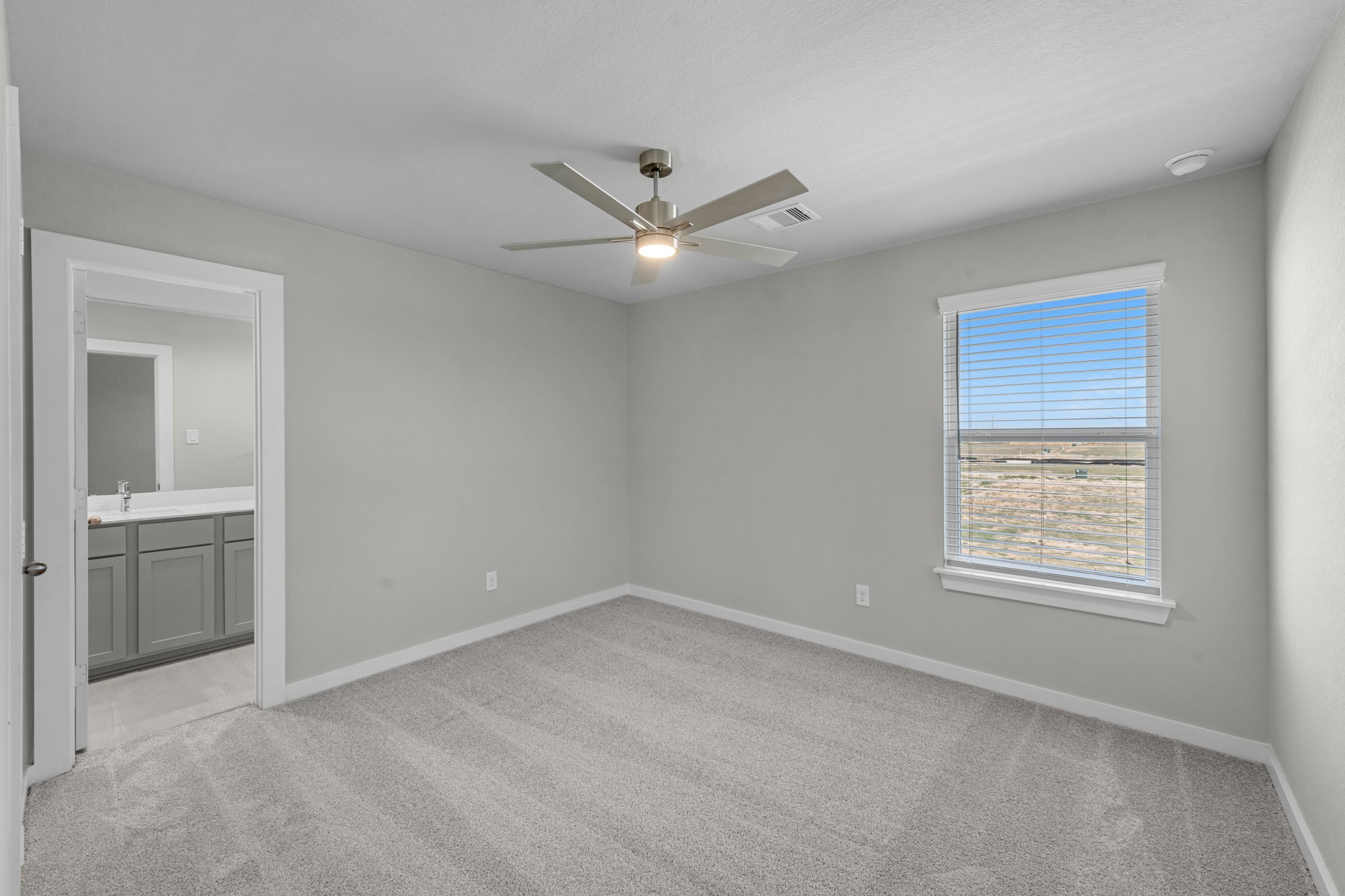 2129 Sunflower View Street Brookshire, TX 77423 - Photo 22 of 29 a view of an empty room with a window and a kitchen