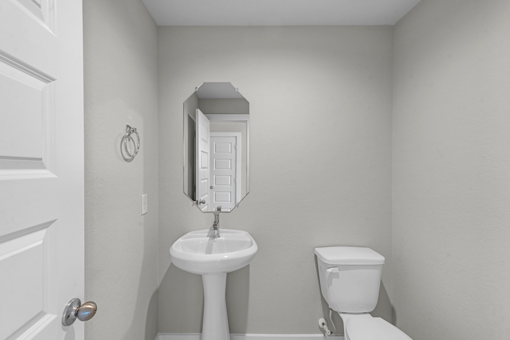 2129 Sunflower View Street Brookshire, TX 77423 - Photo 24 of 29 a bathroom with a toilet sink and mirror