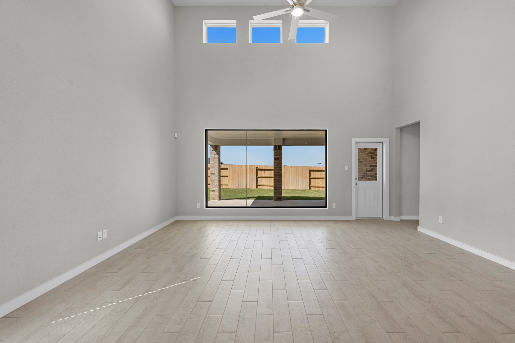 2129 Sunflower View Street Brookshire, TX 77423 - Photo 6 of 29 an empty room with wooden floor and windows