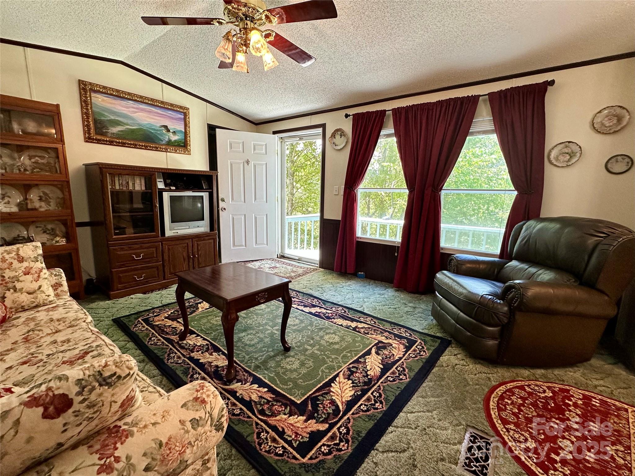 572 Blue Rdg Parkway Spruce Pine, NC 28777 - Photo 11 of 38 a living room with furniture and a large window