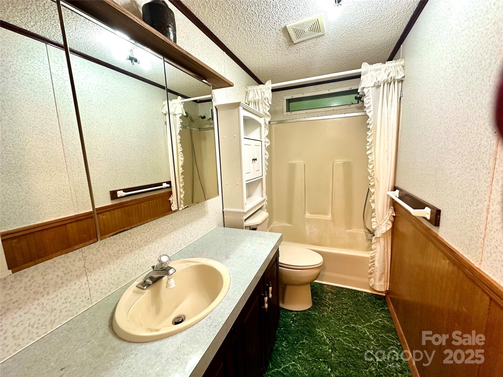 572 Blue Rdg Parkway Spruce Pine, NC 28777 - Photo 17 of 38 a bathroom with a sink toilet and shower