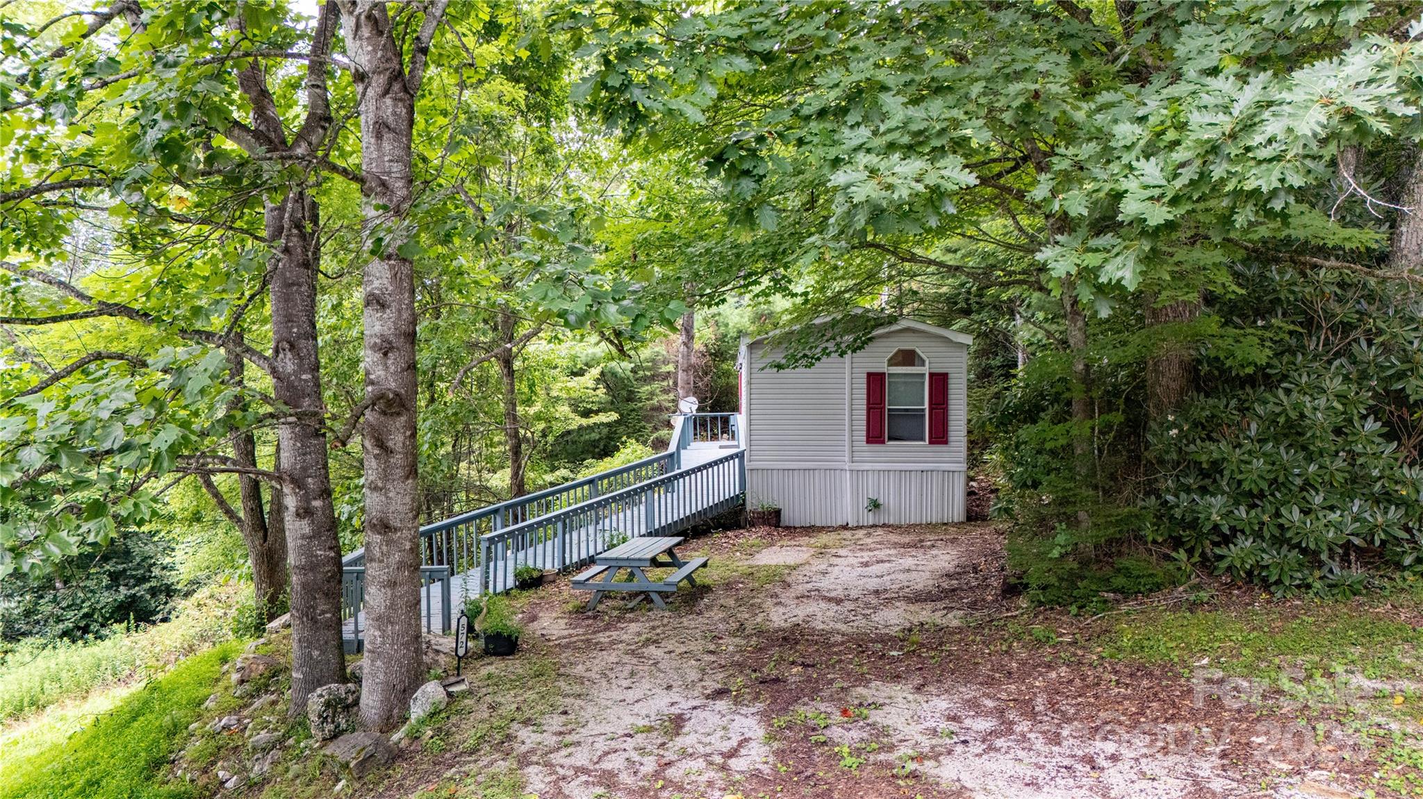 572 Blue Rdg Parkway Spruce Pine, NC 28777 - Photo 28 of 38 a house view with a backyard space
