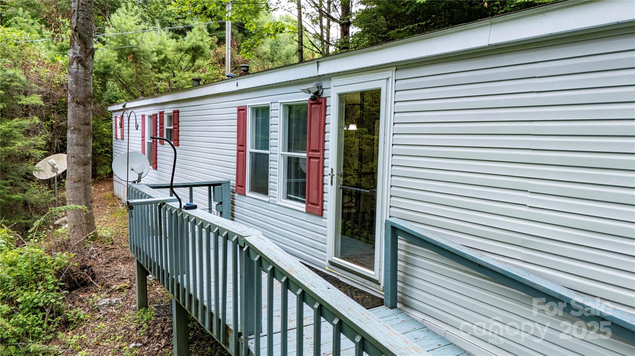 572 Blue Rdg Parkway Spruce Pine, NC 28777 - Photo 33 of 38 a view of a house with backyard and deck