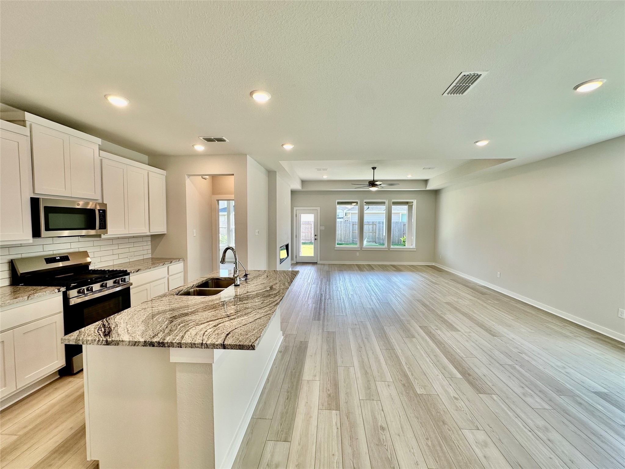 21619 Flannel Bush Lane Cypress, TX 77433 - Photo 14 of 34 a kitchen with sink and microwave