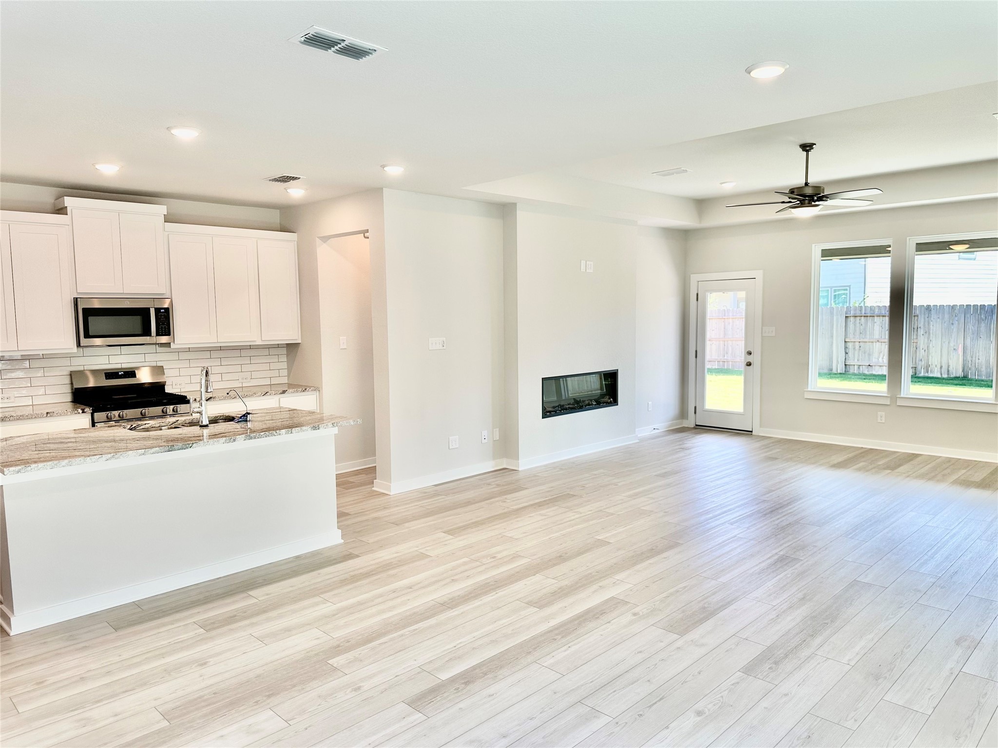 21619 Flannel Bush Lane Cypress, TX 77433 - Photo 15 of 34 a view of kitchen with granite countertop stove top oven and sink