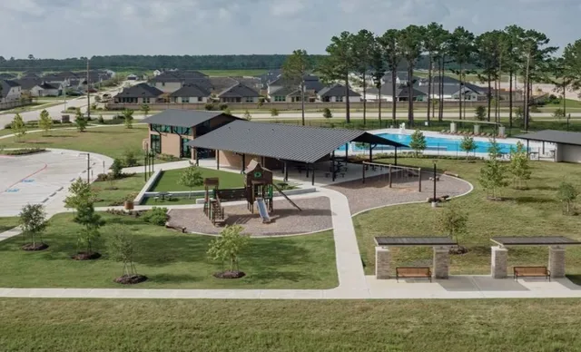 an aerial view of a house with outdoor space