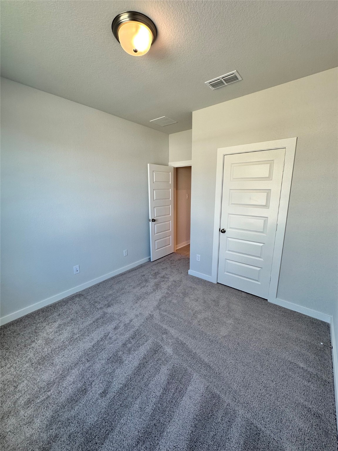 21619 Flannel Bush Lane Cypress, TX 77433 - Photo 6 of 34 an empty room with a empty space and windows