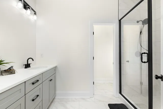 a bathroom with a sink and mirror