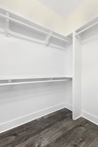 a view of an empty walk in closet