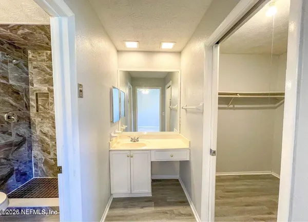 a bathroom with a sink and a mirror