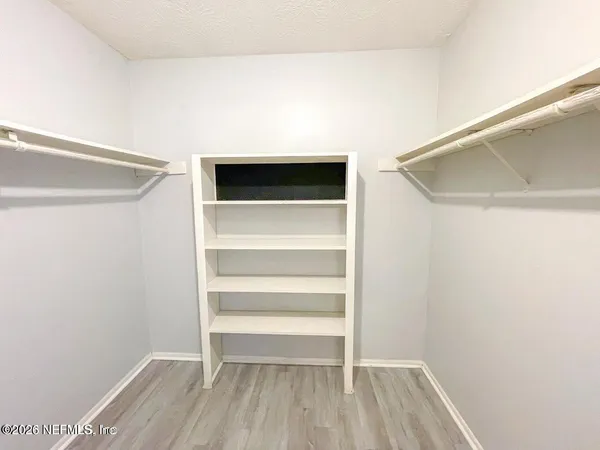 a view of an empty walk in closet