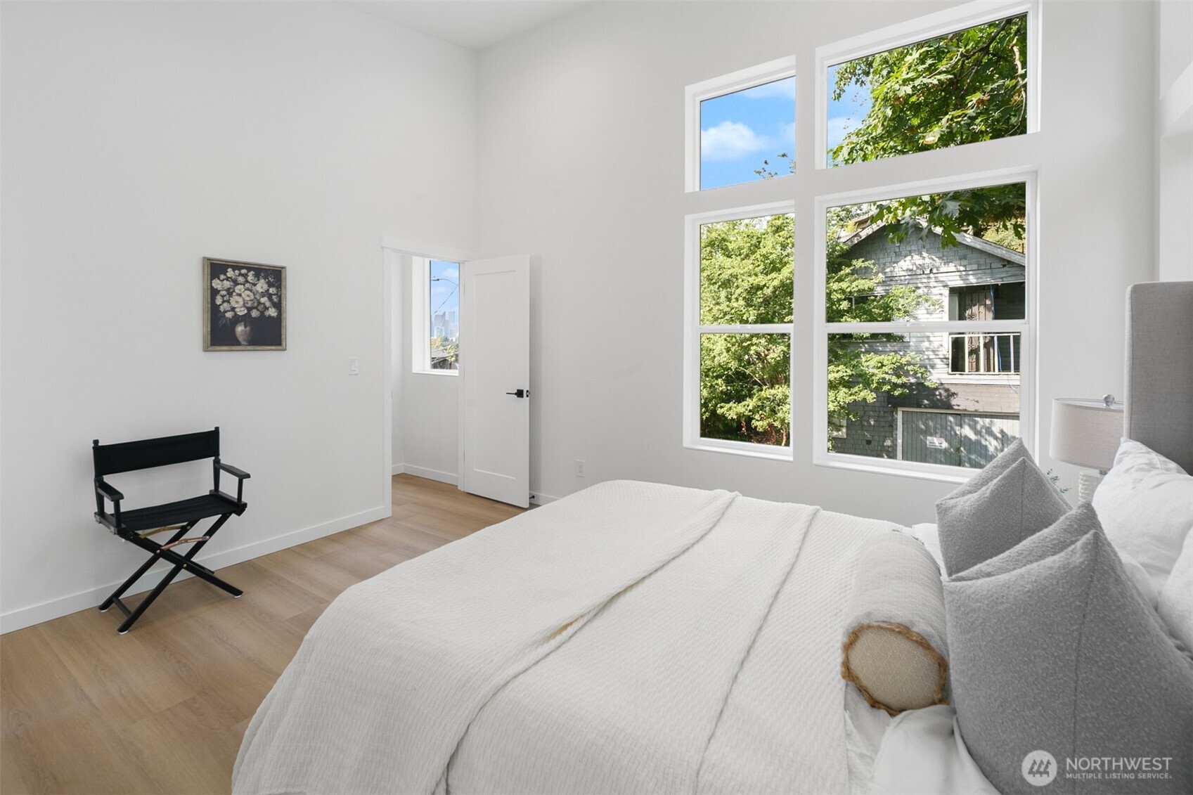 2809 South Grand Street Seattle, WA 98144 - Photo 12 of 28 a bedroom with a bed and large windows