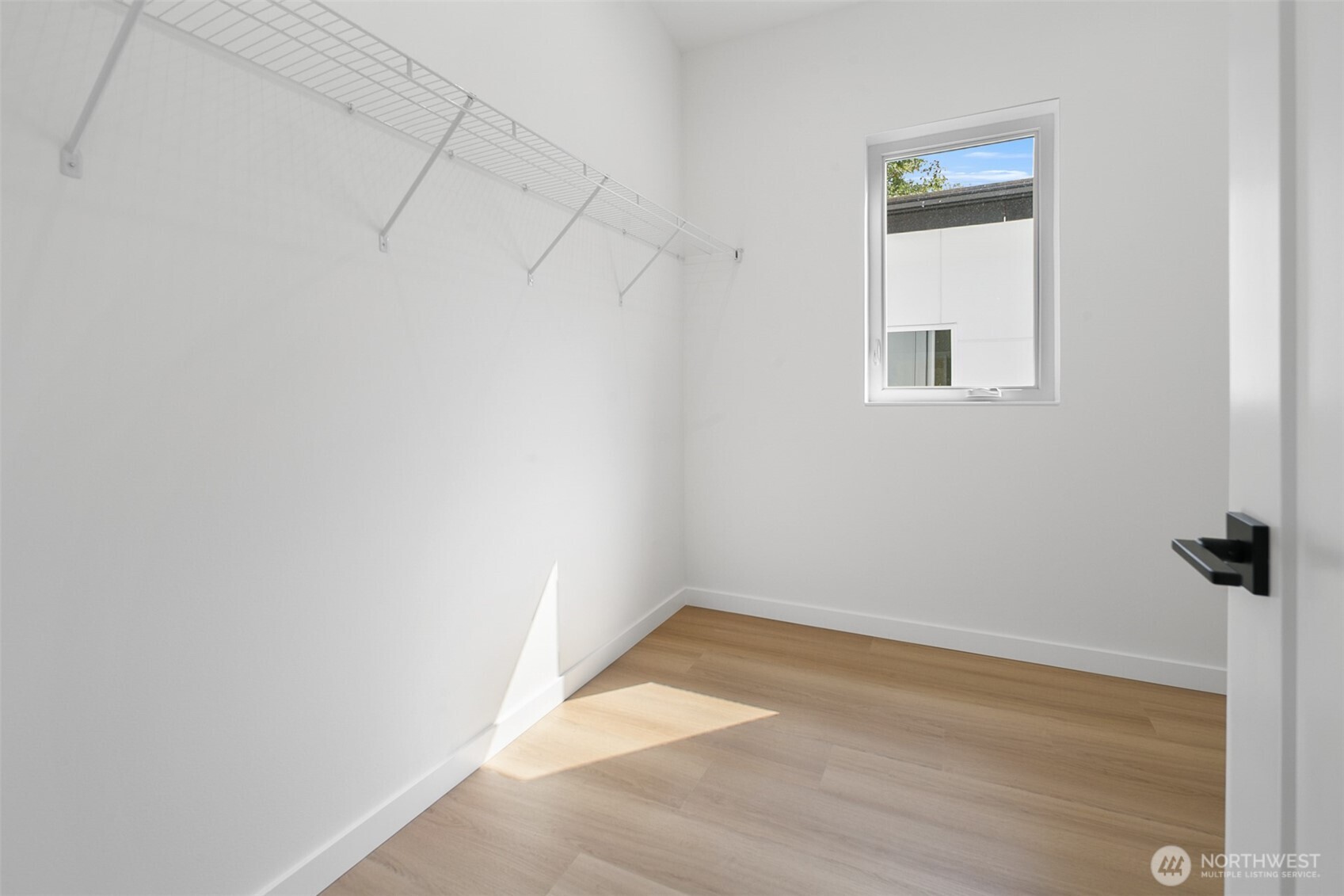 2809 South Grand Street Seattle, WA 98144 - Photo 14 of 28 a view of a small space with wooden floor and a window