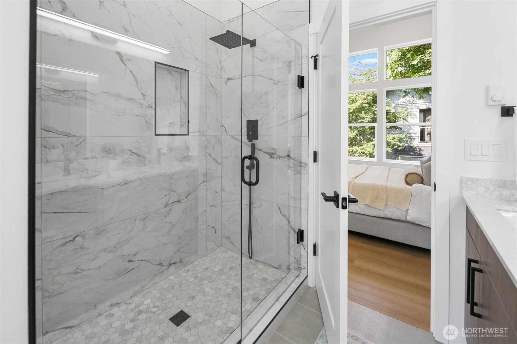 2809 South Grand Street Seattle, WA 98144 - Photo 17 of 28 a bathroom with a glass shower door