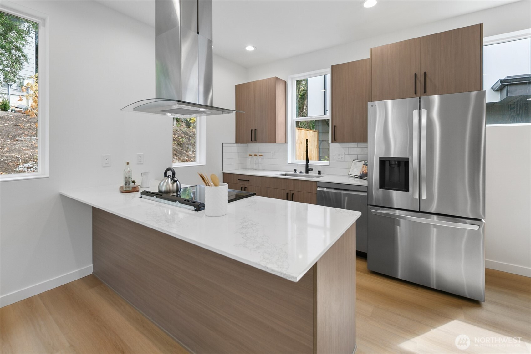 2809 South Grand Street Seattle, WA 98144 - Photo 8 of 28 a kitchen with kitchen island a sink appliances and cabinets