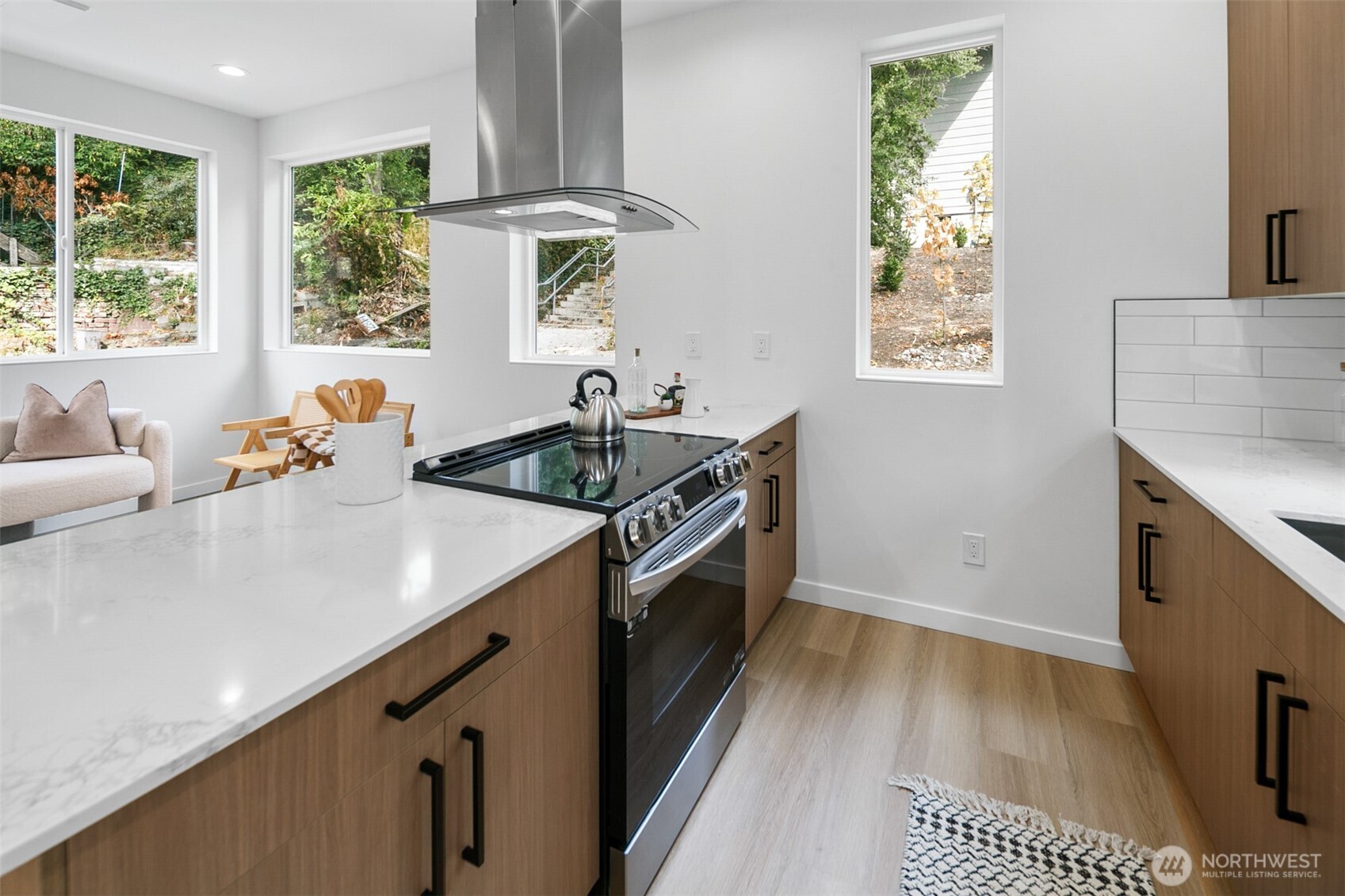 2809 South Grand Street Seattle, WA 98144 - Photo 9 of 28 a kitchen with a sink stove and cabinets