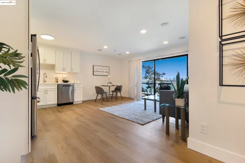 a view of a kitchen with dining table and chairs