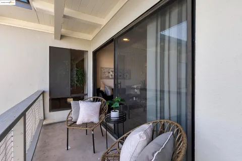 a view of a hallway with seating area