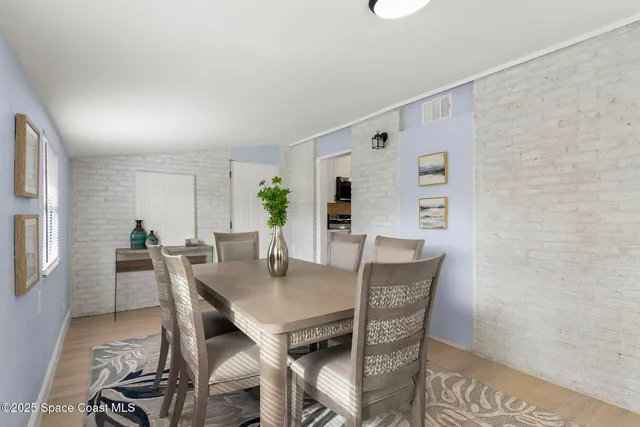 a view of a dining room with furniture and window