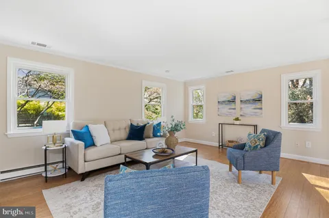 a living room with furniture and a rug