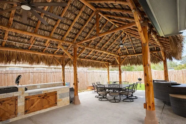 a view of swimming pool with outdoor seating