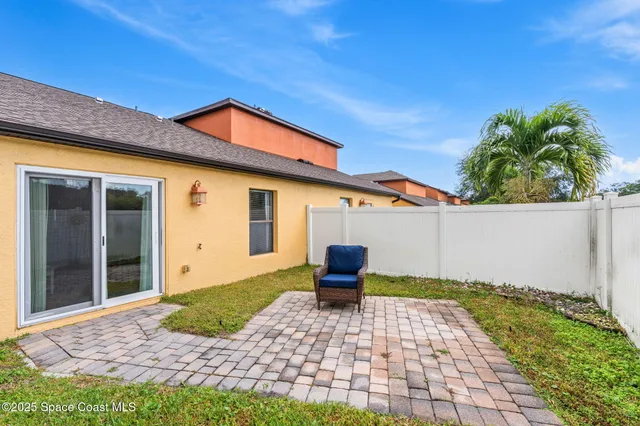 a backyard of a house with seating space