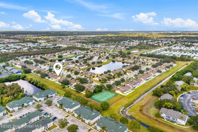 an aerial view of residential building and ocean