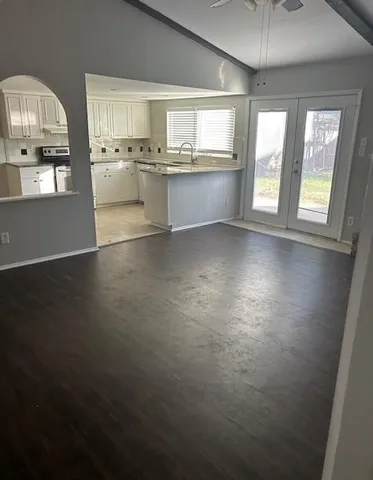 a kitchen with microwave and cabinets