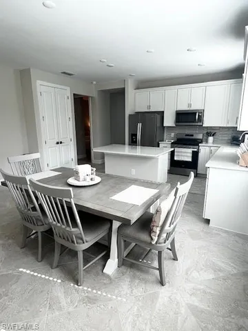 a view of a dining room with furniture