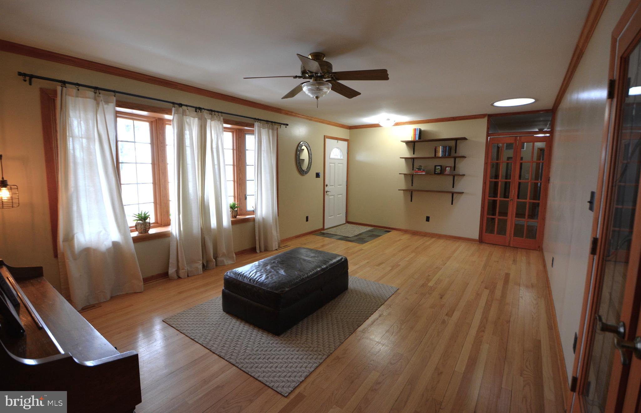 1658 Sams Creek Road Westminster, MD 21157 - Photo 14 of 59 a living room with furniture and a large window