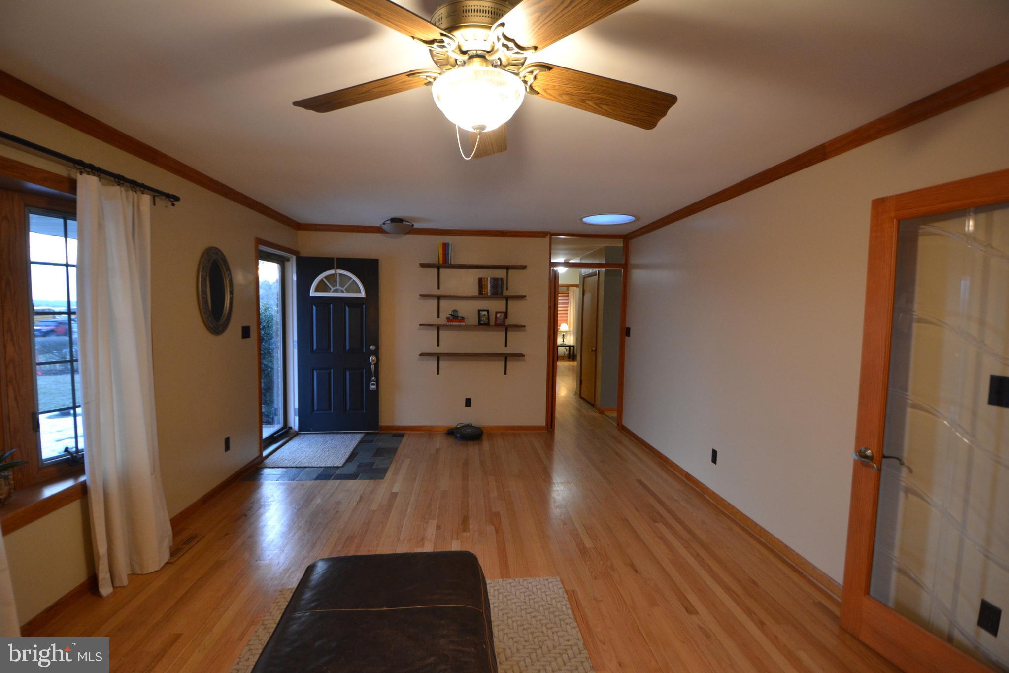 1658 Sams Creek Road Westminster, MD 21157 - Photo 15 of 59 a view of empty room with wooden floor