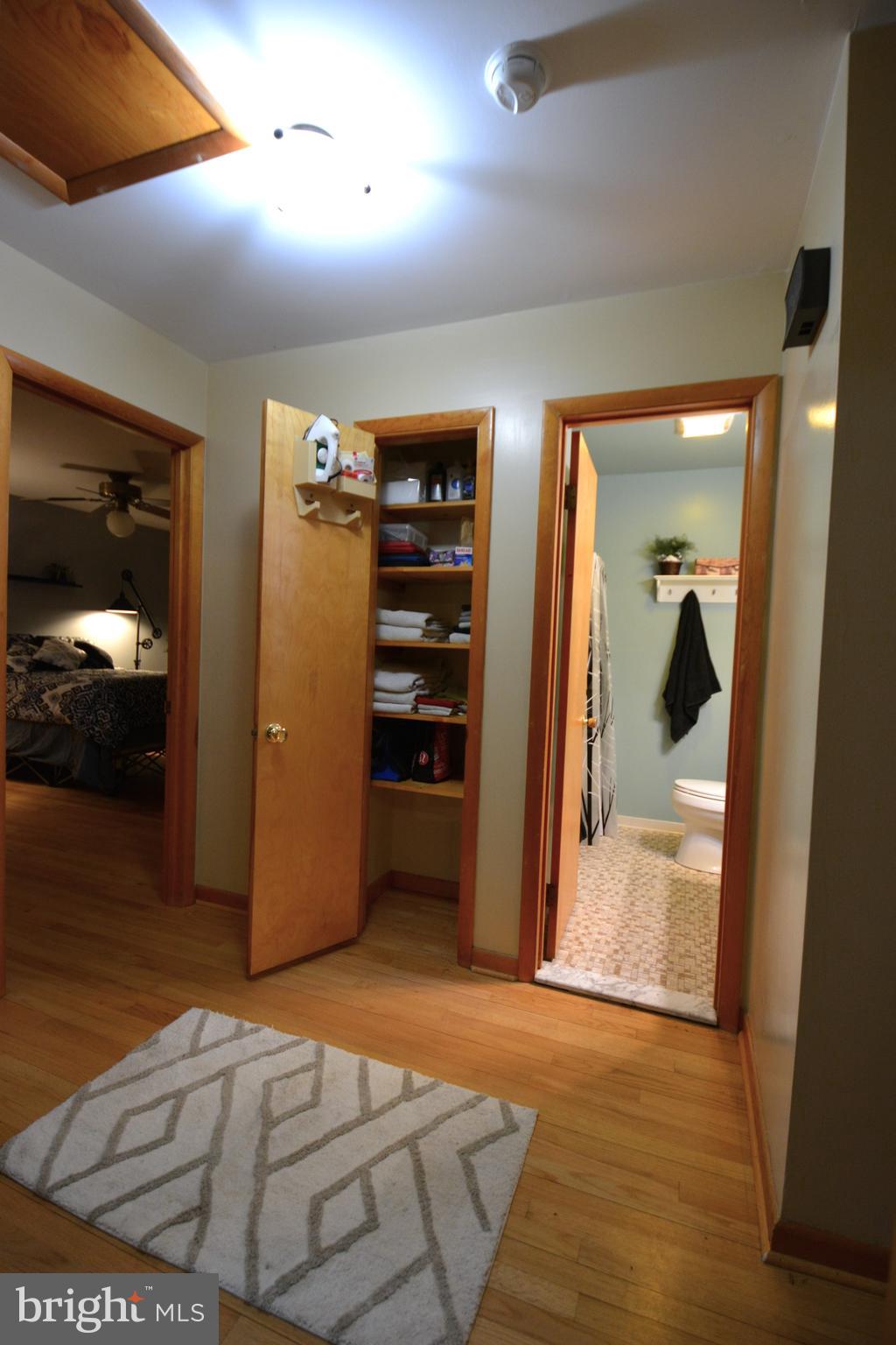 1658 Sams Creek Road Westminster, MD 21157 - Photo 17 of 59 a view of walk in closet with clothes and shoes