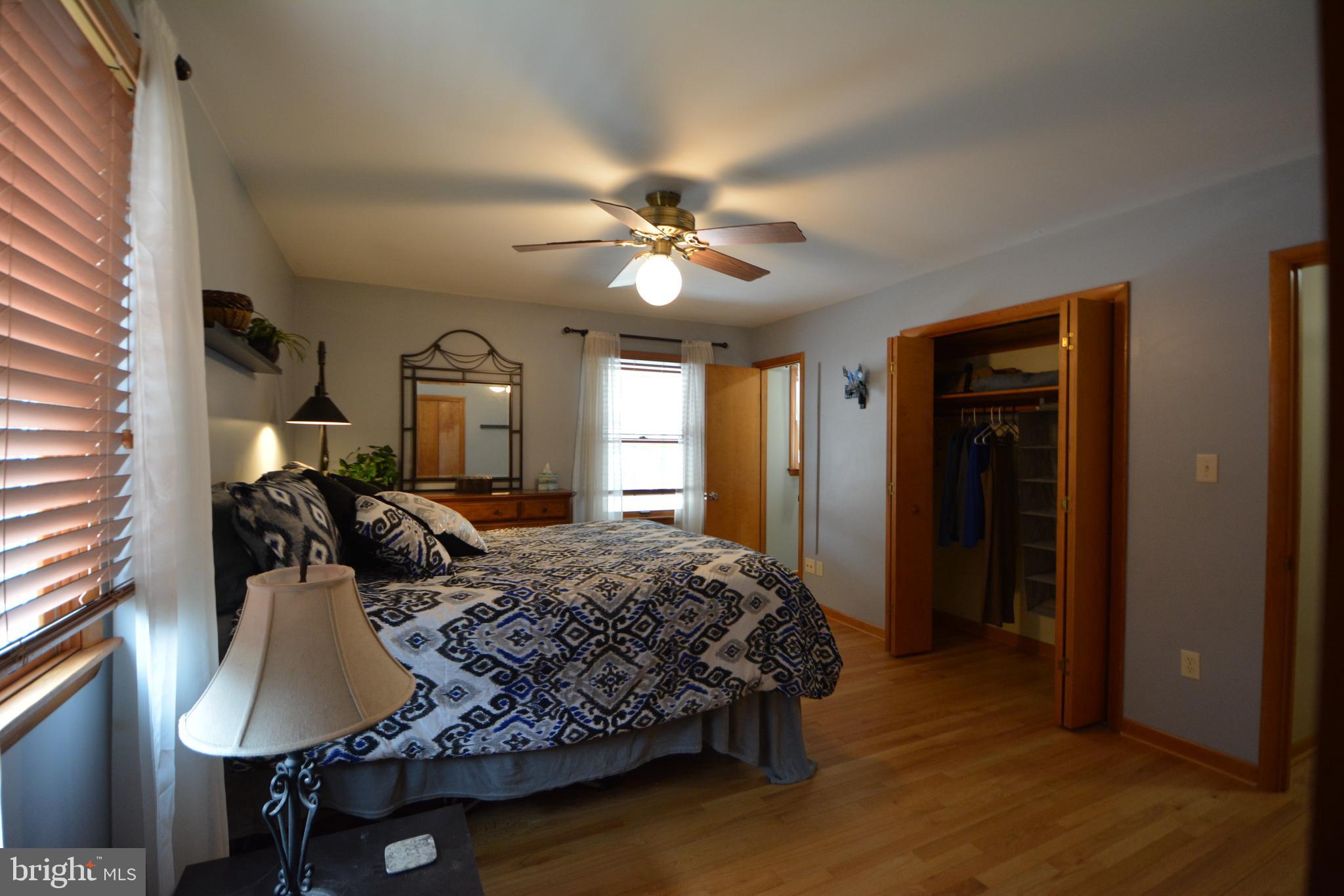 1658 Sams Creek Road Westminster, MD 21157 - Photo 20 of 59 a bedroom with a bed ceiling fan and a window