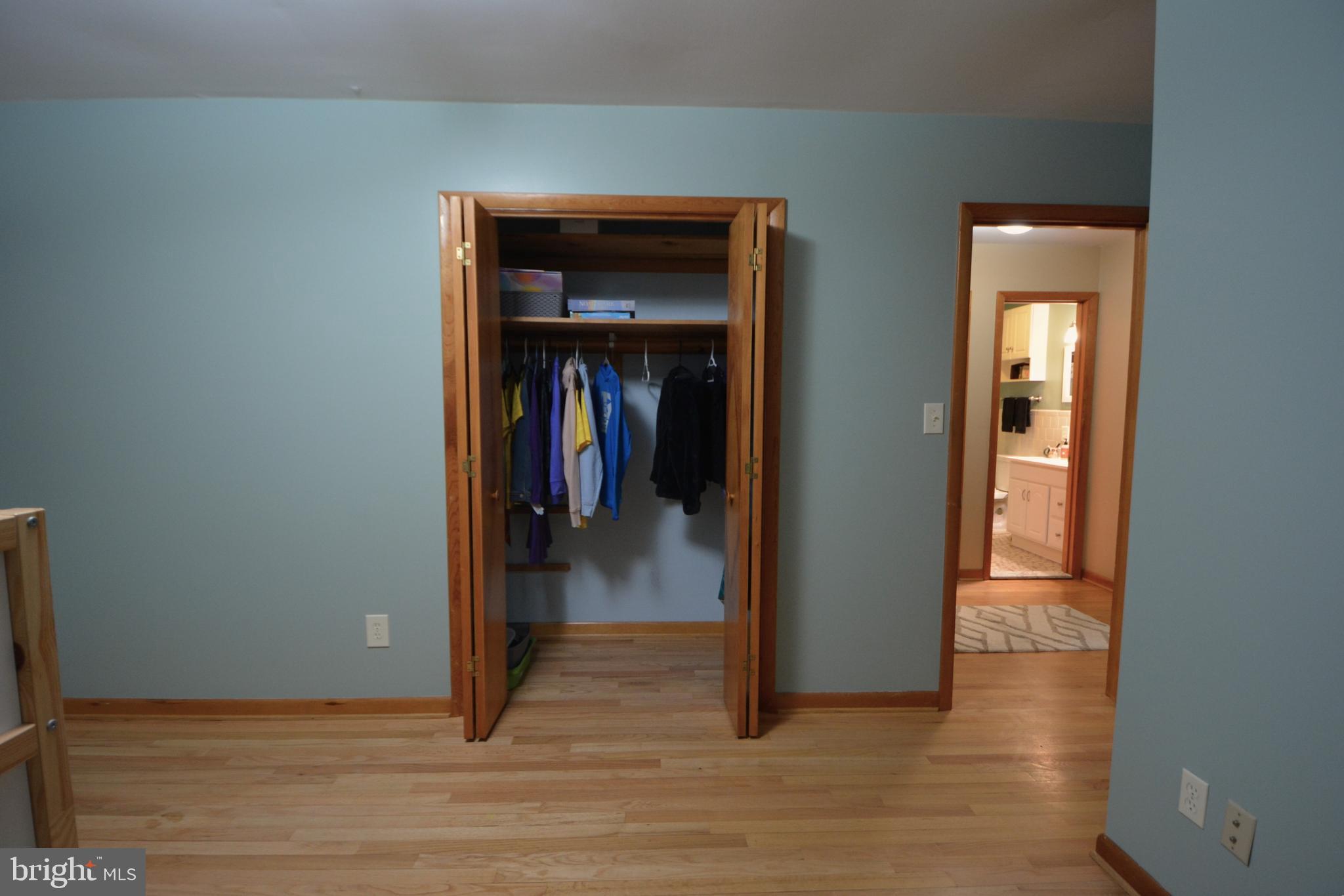1658 Sams Creek Road Westminster, MD 21157 - Photo 25 of 59 a view of a hallway with wooden floor and closet
