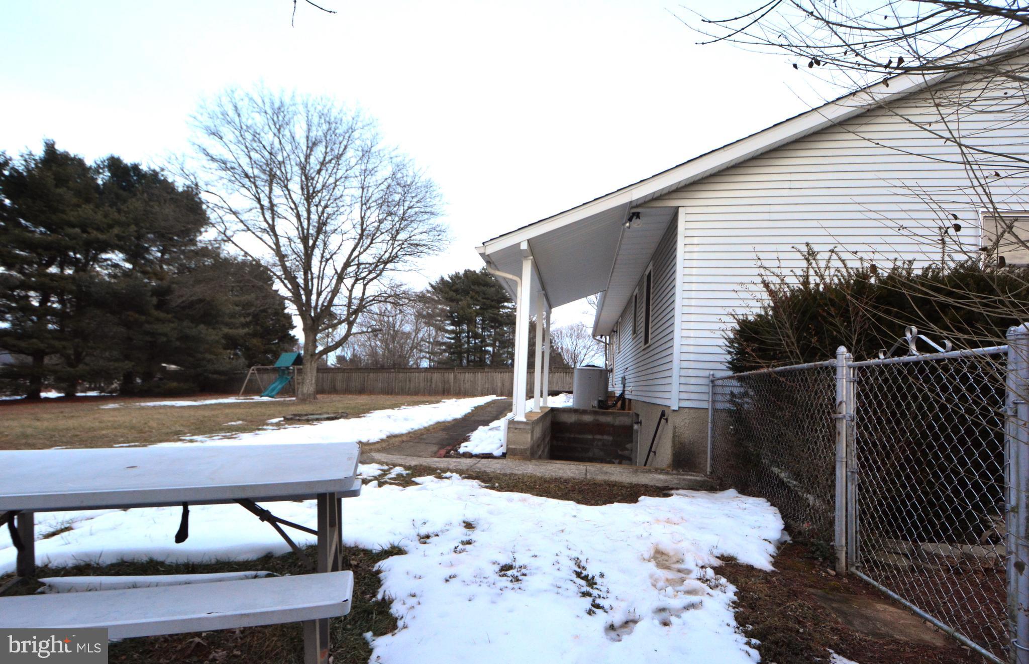 1658 Sams Creek Road Westminster, MD 21157 - Photo 36 of 59 a view of a patio with a yard