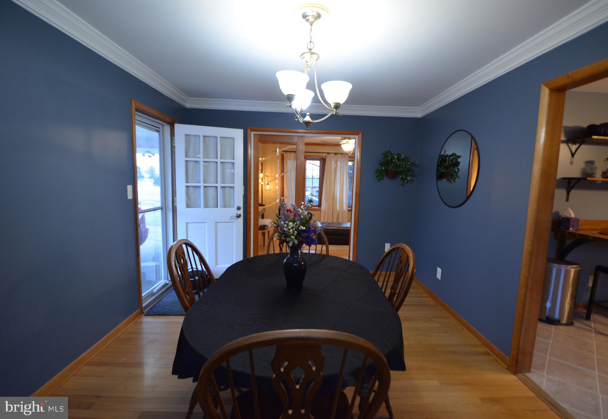 1658 Sams Creek Road Westminster, MD 21157 - Photo 4 of 59 a view of a dining room with furniture window and wooden floor