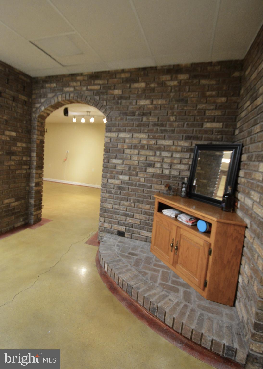 1658 Sams Creek Road Westminster, MD 21157 - Photo 46 of 59 a view of living room with stainless steel appliances wooden floor and a fireplace