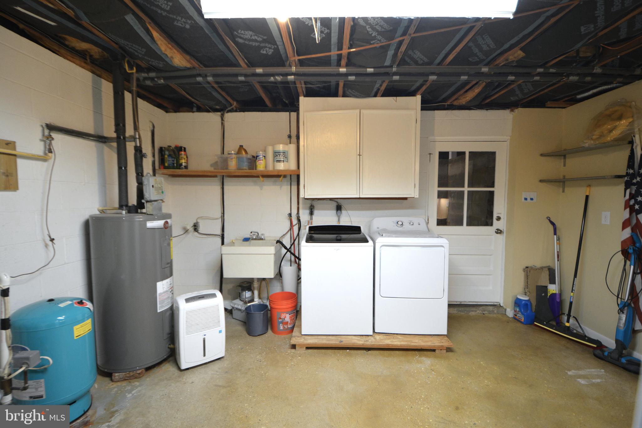 1658 Sams Creek Road Westminster, MD 21157 - Photo 52 of 59 a utility room with dryer and washer