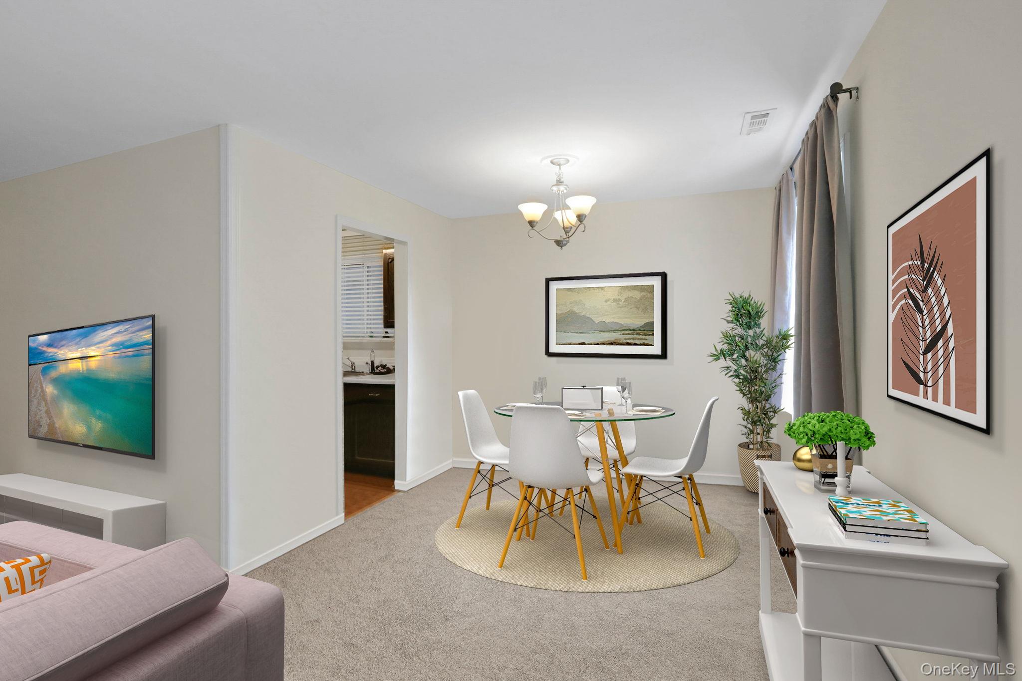 302 Commons Way, Unit E Fishkill, NY 12524 - Photo 11 of 26 Virtually staged. Dining area with light colored carpet and a chandelier