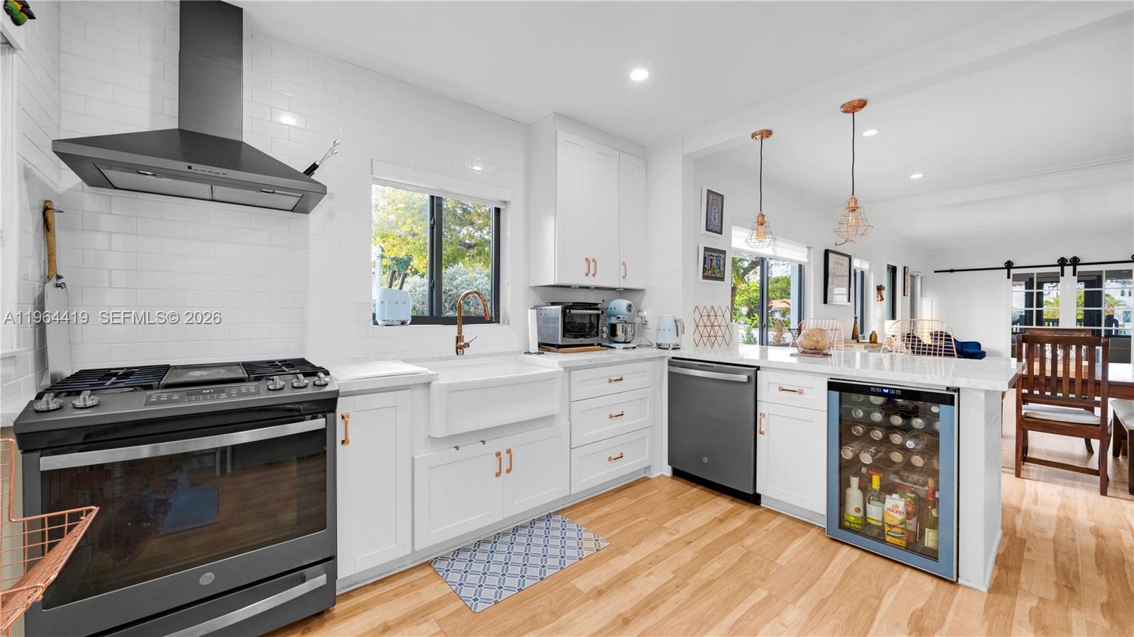 375 Southwest 32nd Road Miami, FL 33129 - Photo 11 of 39 a kitchen with a sink stove and cabinets