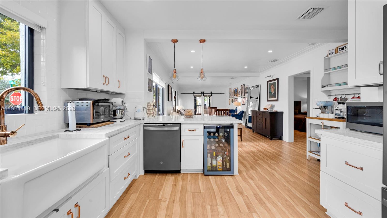 375 Southwest 32nd Road Miami, FL 33129 - Photo 13 of 39 a kitchen with cabinets and wooden floor