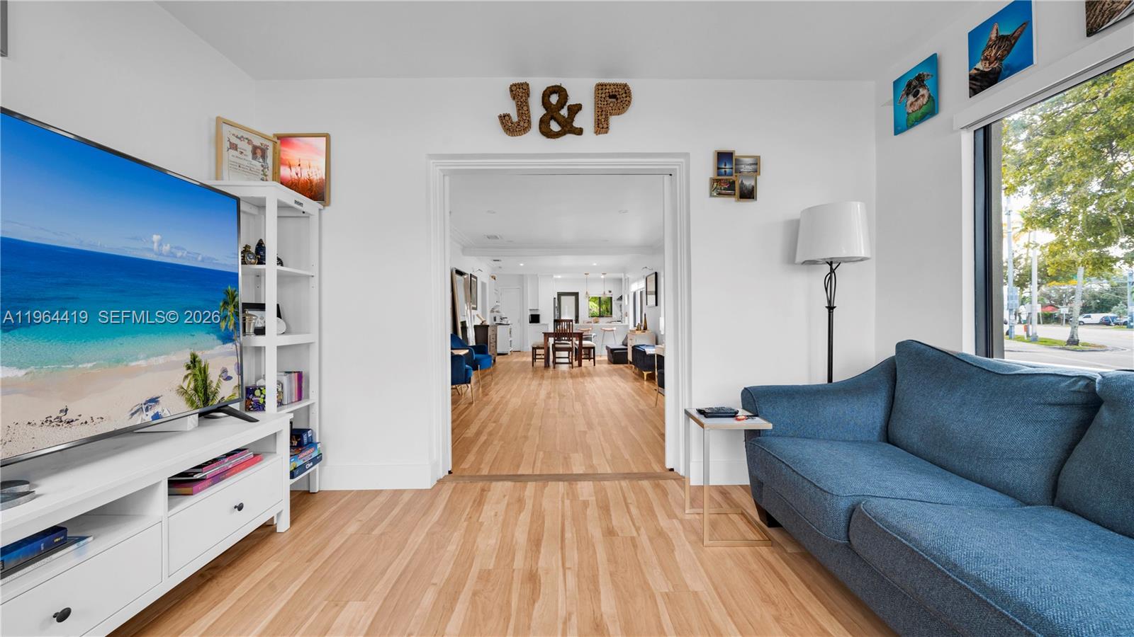 375 Southwest 32nd Road Miami, FL 33129 - Photo 18 of 39 a living room with furniture and a book shelf