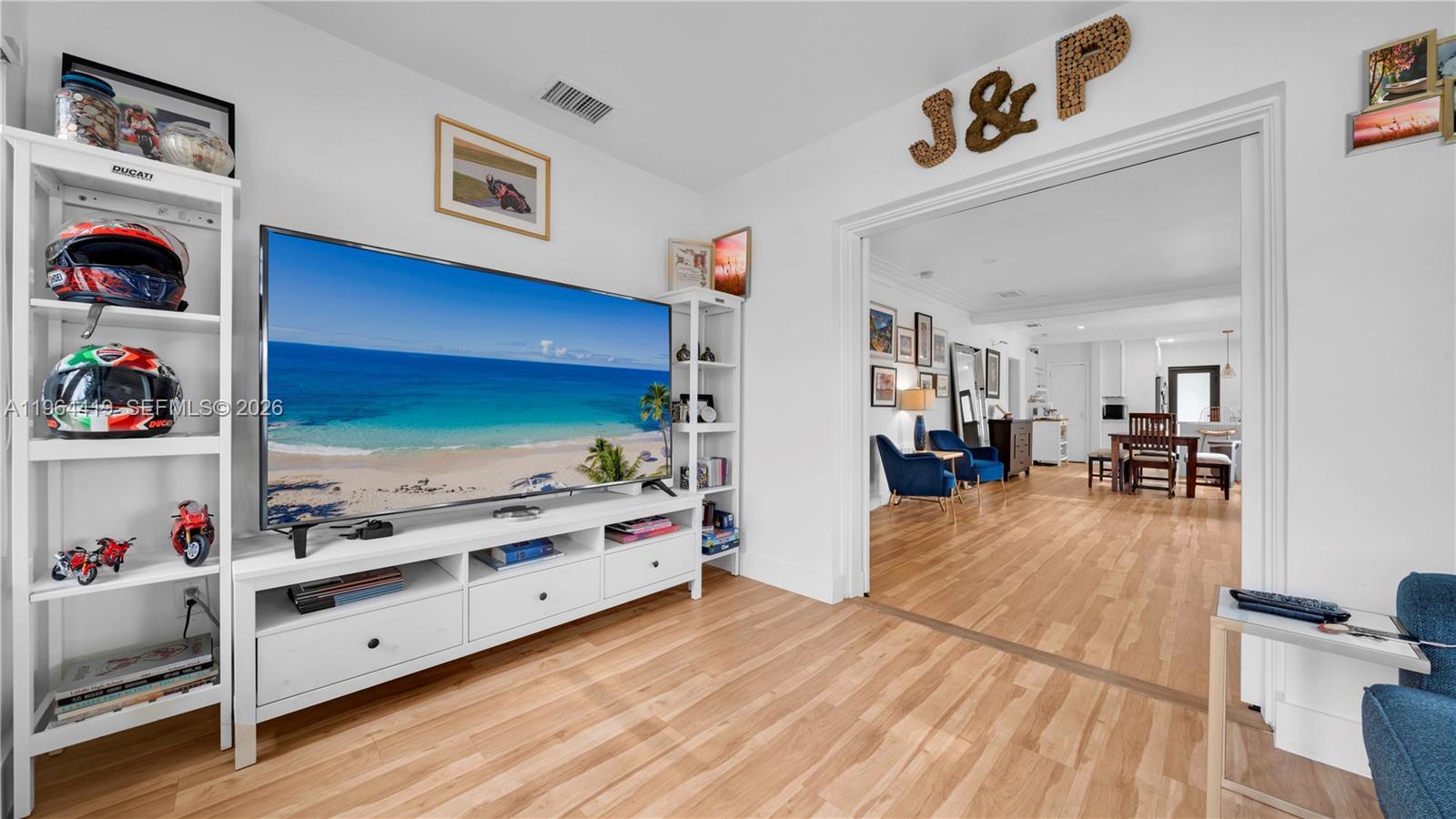 375 Southwest 32nd Road Miami, FL 33129 - Photo 19 of 39 a living room with furniture and flat screen tv