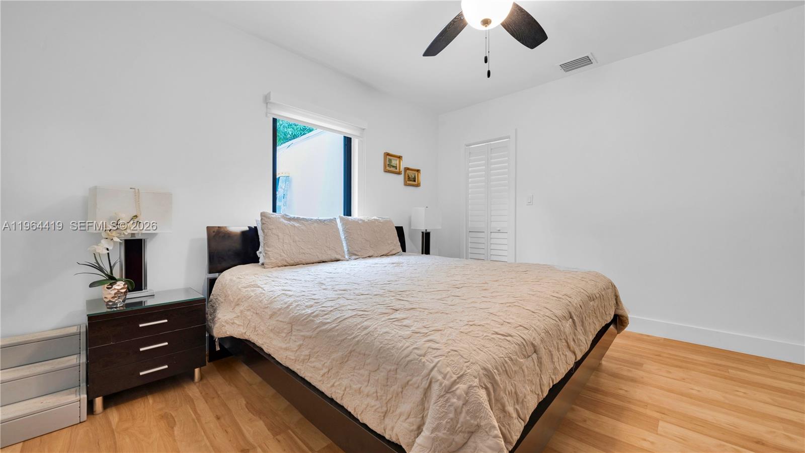 375 Southwest 32nd Road Miami, FL 33129 - Photo 21 of 39 a bedroom with a bed and window