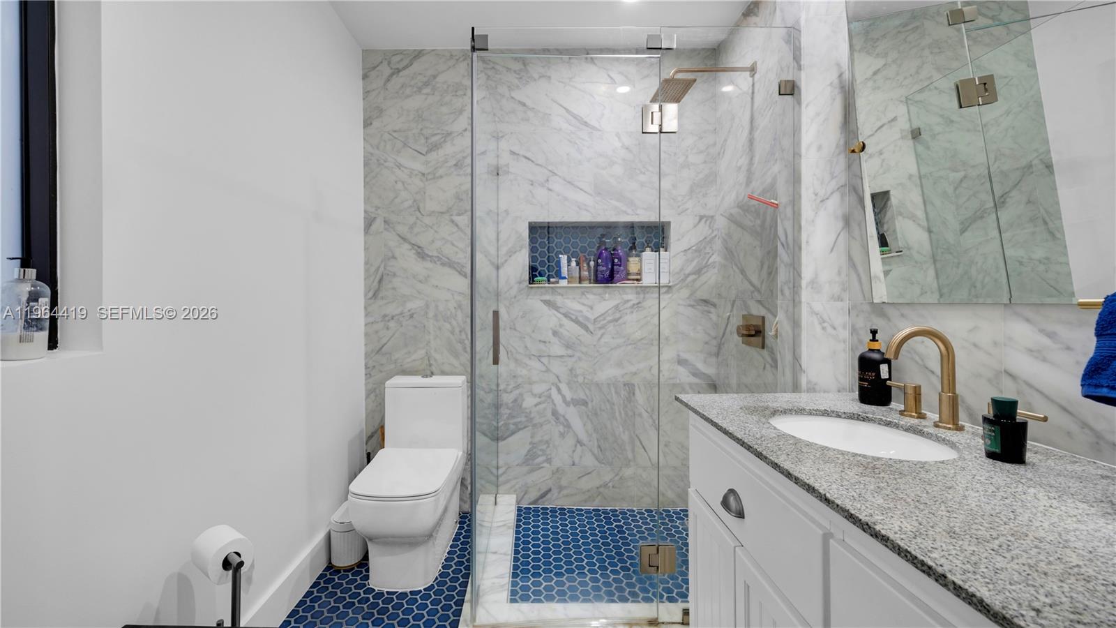 375 Southwest 32nd Road Miami, FL 33129 - Photo 28 of 39 a bathroom with a granite countertop sink toilet and shower