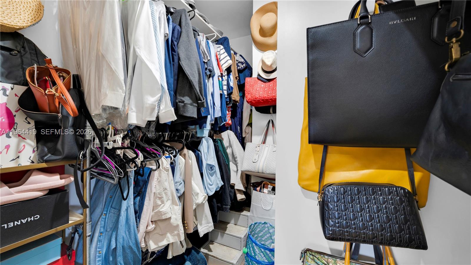 375 Southwest 32nd Road Miami, FL 33129 - Photo 30 of 39 a view of walk in closet with clothes and shoes