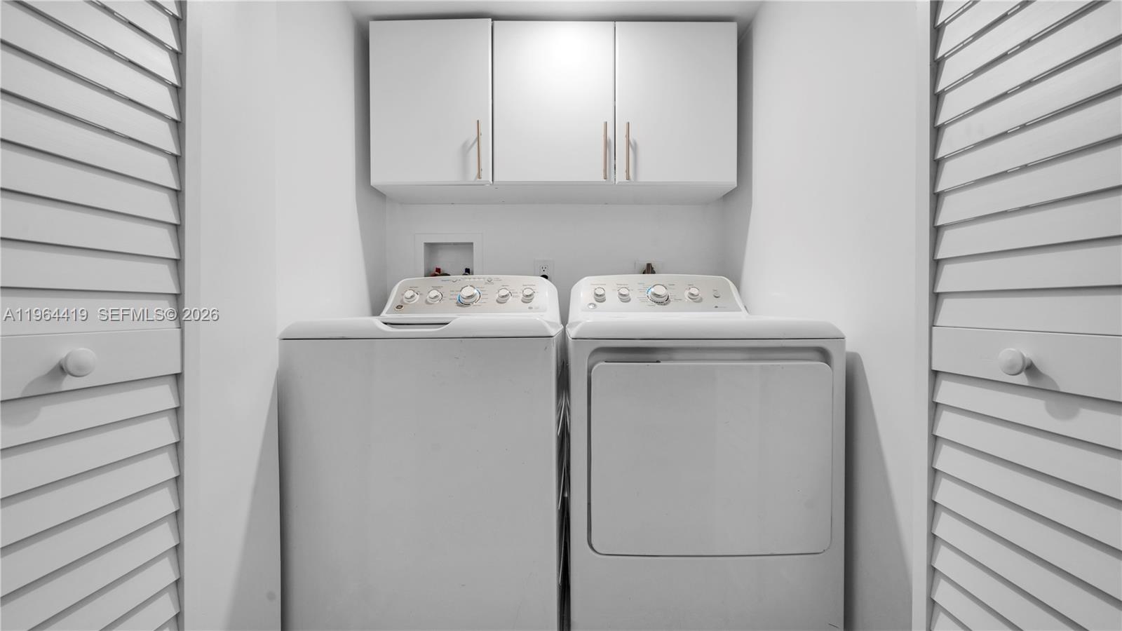 375 Southwest 32nd Road Miami, FL 33129 - Photo 31 of 39 a utility room with dryer and washer