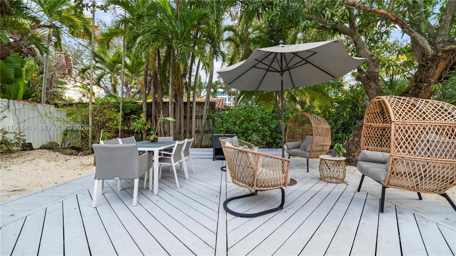 375 Southwest 32nd Road Miami, FL 33129 - Photo 33 of 39 a view of house with patio outdoor seating and wooden floor