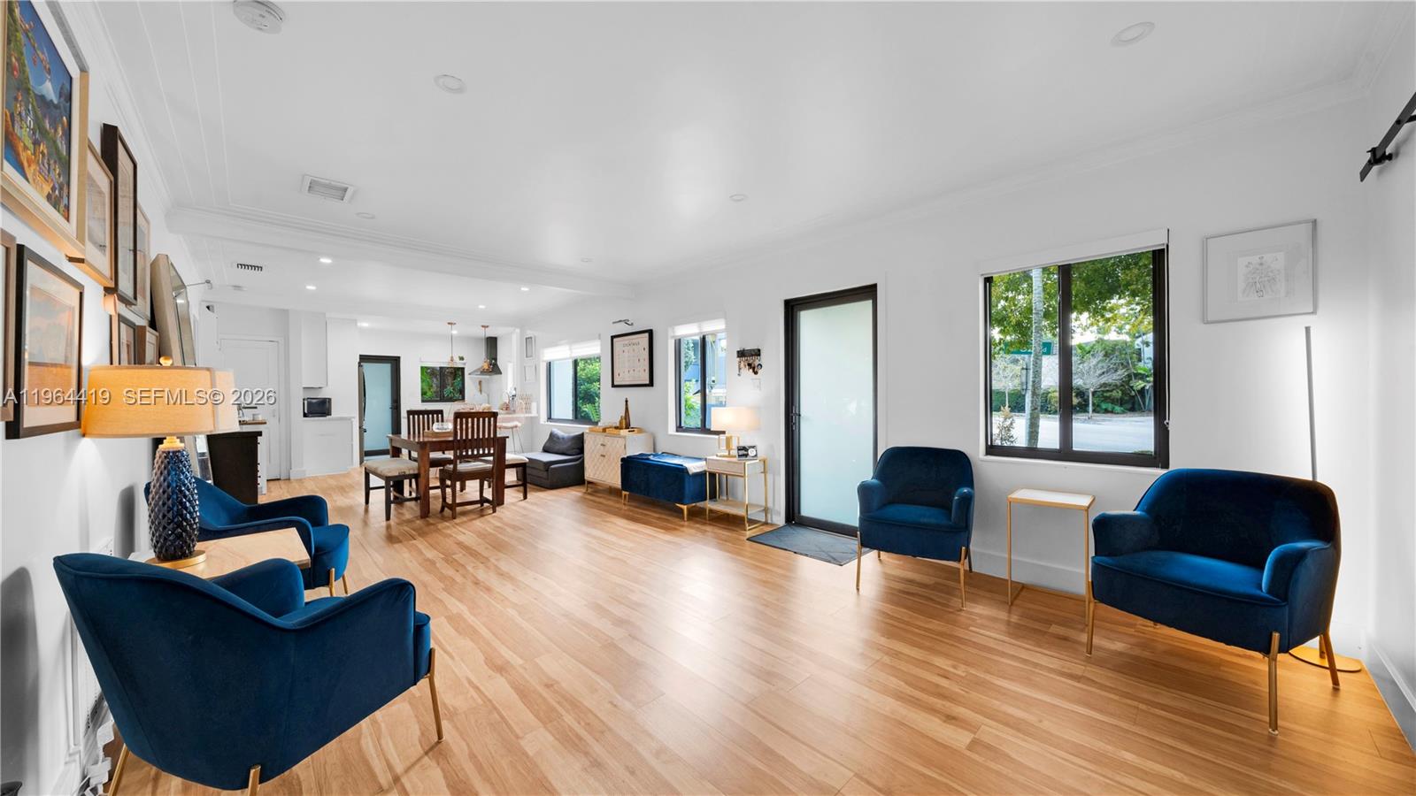 375 Southwest 32nd Road Miami, FL 33129 - Photo 5 of 39 a living room with furniture and a large window
